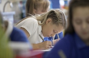 Female pupil writing